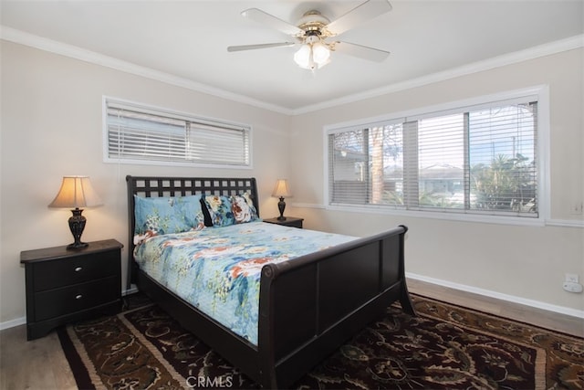 bedroom with ceiling fan, ornamental molding, and dark hardwood / wood-style floors