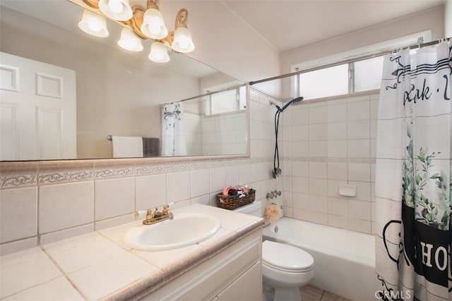 full bathroom with shower / tub combo with curtain, tile walls, backsplash, vanity, and toilet