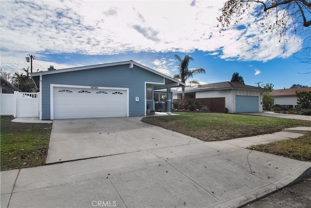 ranch-style home with a garage and a front yard