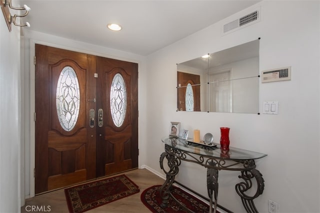 foyer with light wood-type flooring