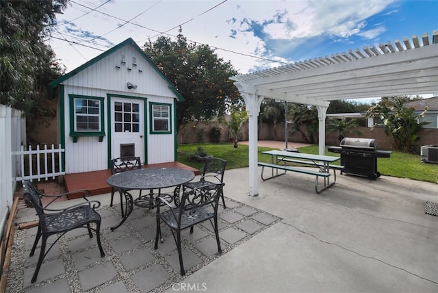 view of patio featuring area for grilling, cooling unit, a pergola, and an outdoor structure