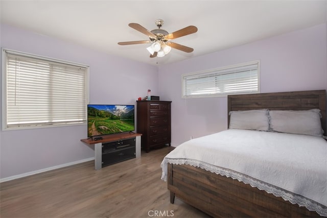 bedroom featuring wood-type flooring and ceiling fan