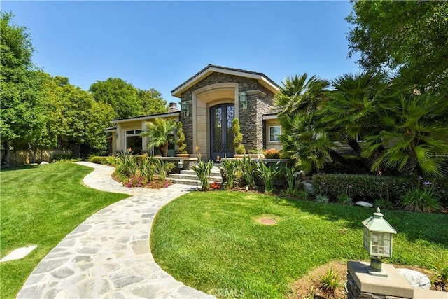 view of front of home with a front lawn