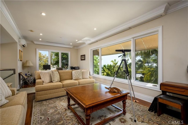 living room with a wall mounted air conditioner, crown molding, and wood-type flooring