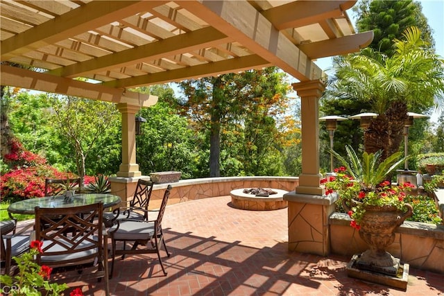 view of patio with a pergola and an outdoor fire pit