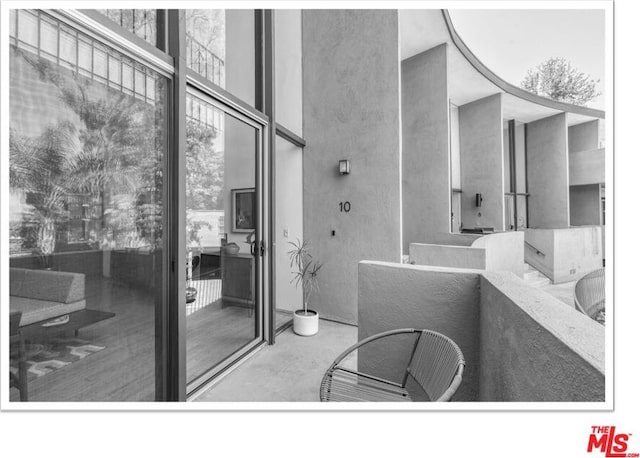 bathroom with concrete floors and a healthy amount of sunlight