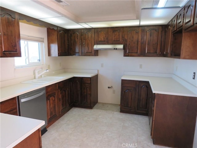 kitchen featuring stainless steel dishwasher, sink, and dark brown cabinets