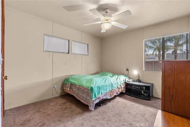 bedroom with ceiling fan and carpet flooring