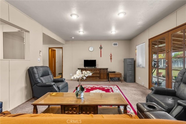 living room with carpet flooring and french doors