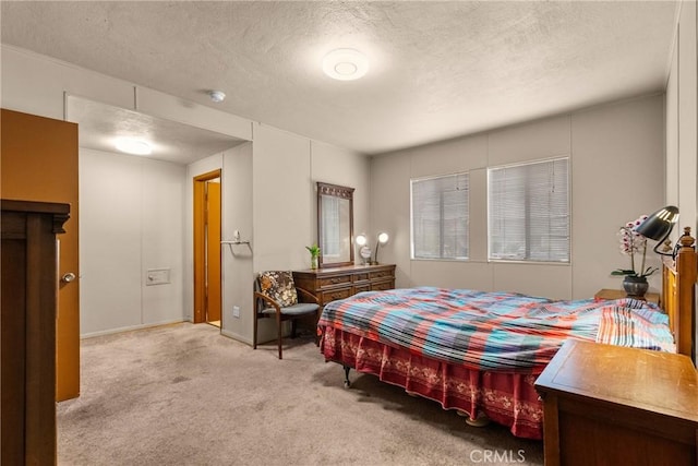 carpeted bedroom featuring a textured ceiling