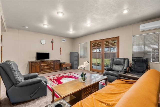 living room featuring a wall mounted air conditioner, french doors, and carpet flooring