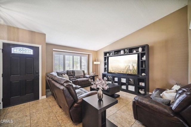 living room featuring light tile patterned floors and vaulted ceiling