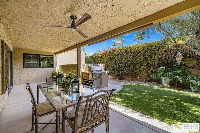 view of patio featuring ceiling fan and a grill