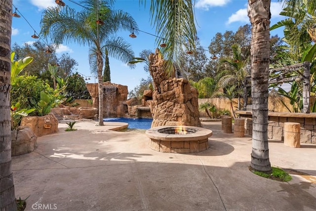 view of patio / terrace featuring a fire pit