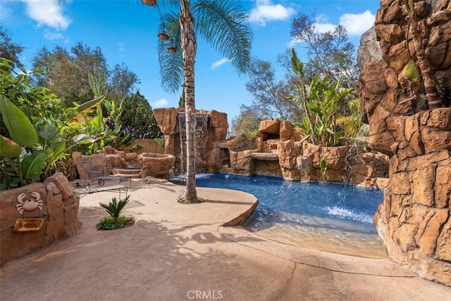 view of pool featuring pool water feature