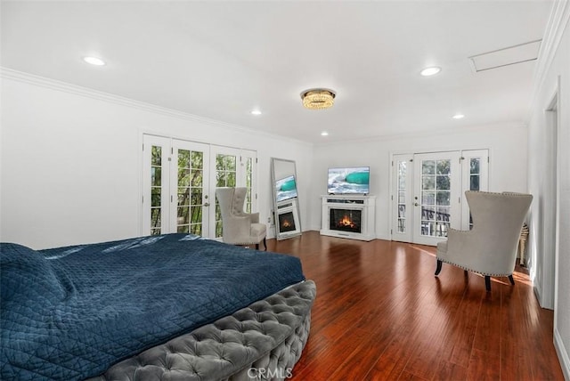 bedroom featuring french doors, access to exterior, crown molding, and hardwood / wood-style flooring