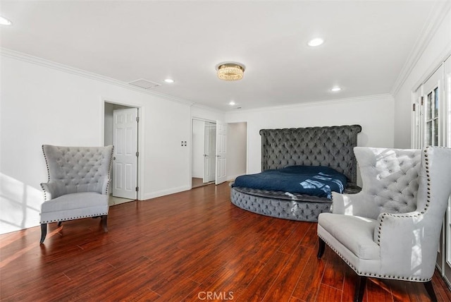 bedroom with wood-type flooring and crown molding