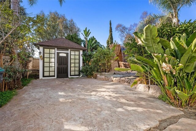 view of patio / terrace featuring a storage shed