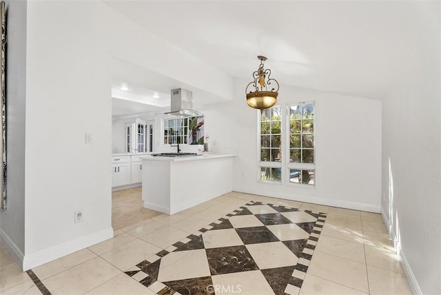 kitchen featuring stainless steel gas cooktop, white cabinets, island exhaust hood, decorative light fixtures, and kitchen peninsula