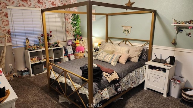 bedroom with dark colored carpet