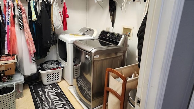 laundry area with separate washer and dryer