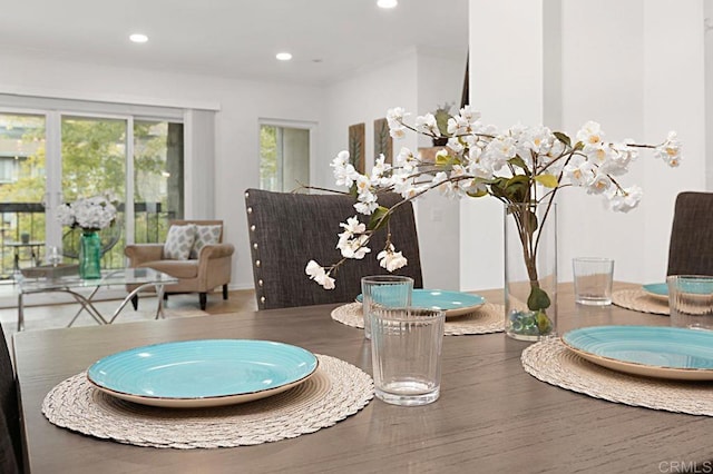 dining space with hardwood / wood-style floors