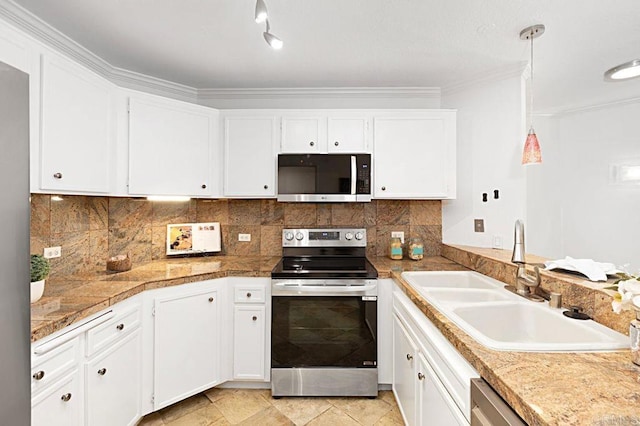 kitchen with appliances with stainless steel finishes, pendant lighting, tasteful backsplash, sink, and white cabinets