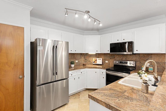 kitchen featuring sink, crown molding, white cabinets, stainless steel appliances, and backsplash