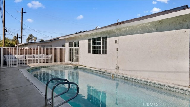 view of pool featuring an outdoor living space and a fenced in pool