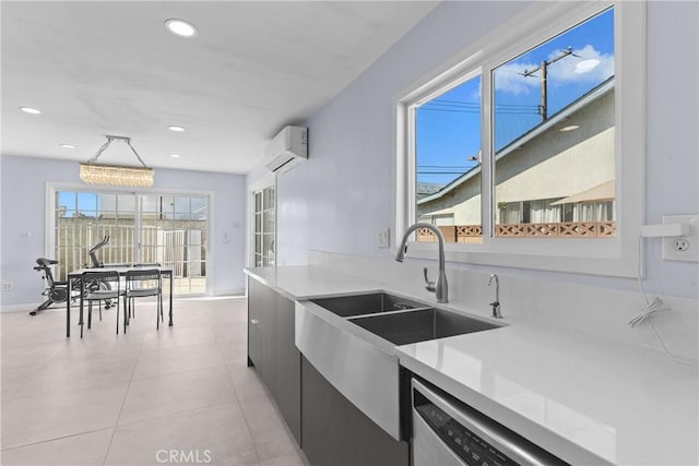 kitchen featuring modern cabinets, light countertops, an AC wall unit, and recessed lighting