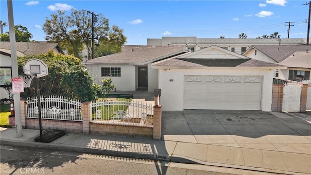 ranch-style house featuring a garage, a gate, fence, and stucco siding