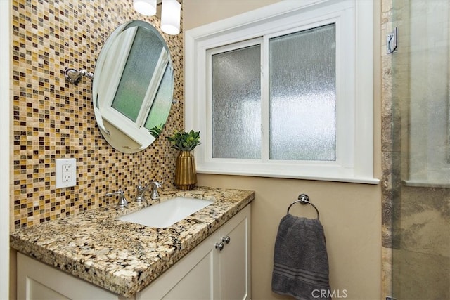 bathroom with vanity and decorative backsplash