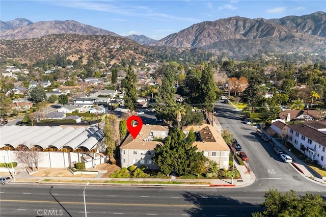 birds eye view of property with a mountain view