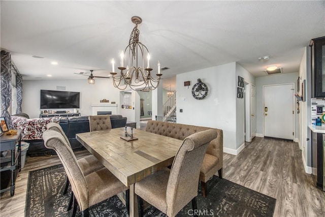 dining room with an inviting chandelier and hardwood / wood-style flooring