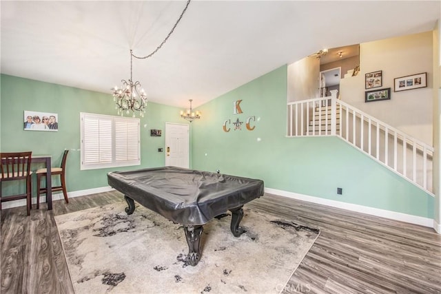 playroom with wood-type flooring, pool table, and a chandelier