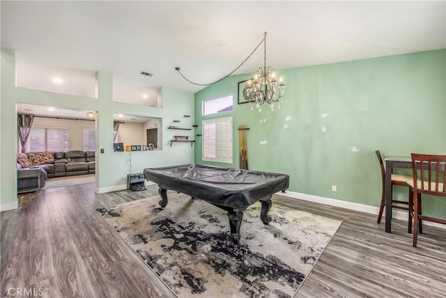 rec room featuring an inviting chandelier, pool table, wood-type flooring, and high vaulted ceiling