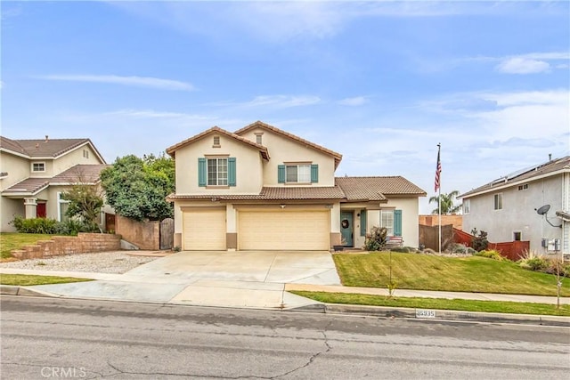 view of front of property with a garage and a front lawn