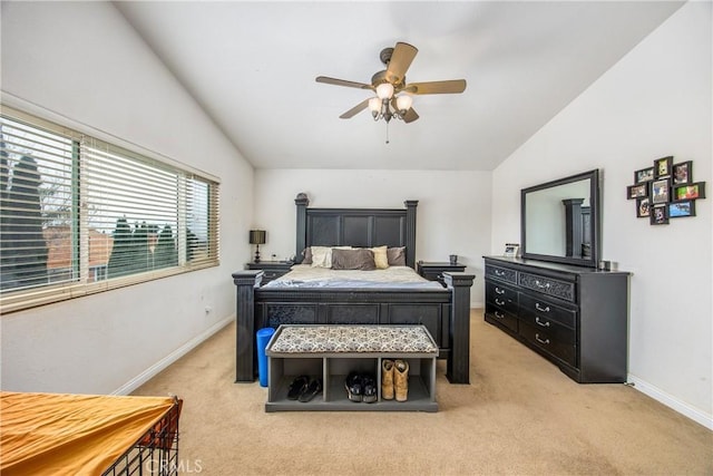 bedroom with vaulted ceiling, light colored carpet, and ceiling fan