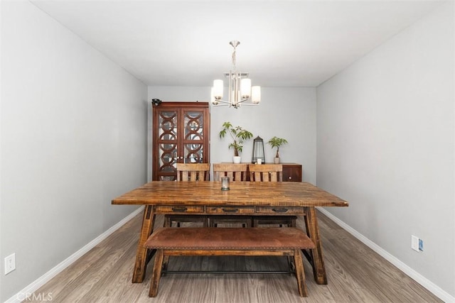 40350 Exa Ely Rd, Hemet, CA 92544 - dining space featuring a chandelier, light wood-type flooring, and baseboards