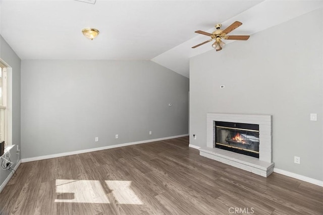 40350 Exa Ely Rd, Hemet, CA 92544 - unfurnished living room featuring wood finished floors, ceiling fan, a brick fireplace, baseboards, and vaulted ceiling