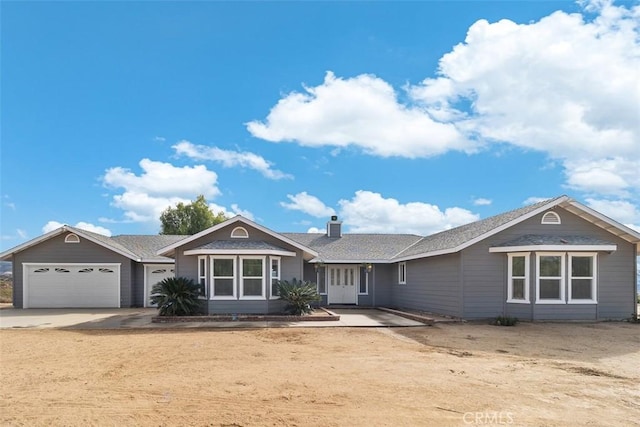 40350 Exa Ely Rd, Hemet, CA 92544 - single story home featuring a garage, driveway, a chimney, and roof with shingles