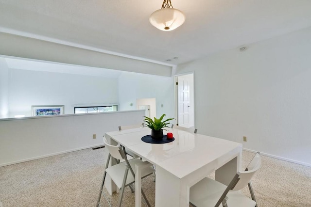 dining space featuring carpet