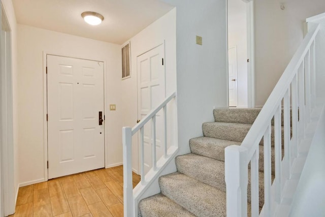 foyer entrance with light hardwood / wood-style flooring