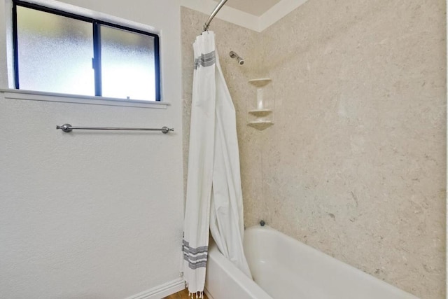 bathroom featuring shower / bath combo with shower curtain