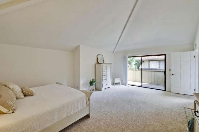 carpeted bedroom with lofted ceiling and access to exterior