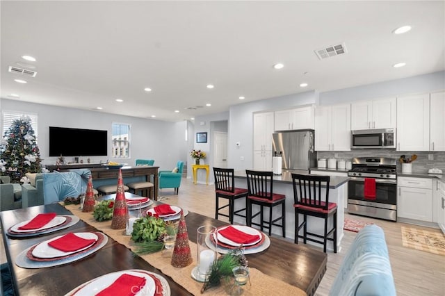 dining space featuring light hardwood / wood-style flooring