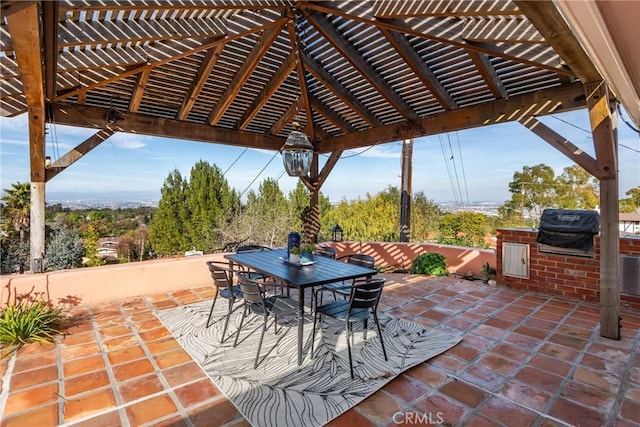 view of patio with area for grilling and exterior kitchen