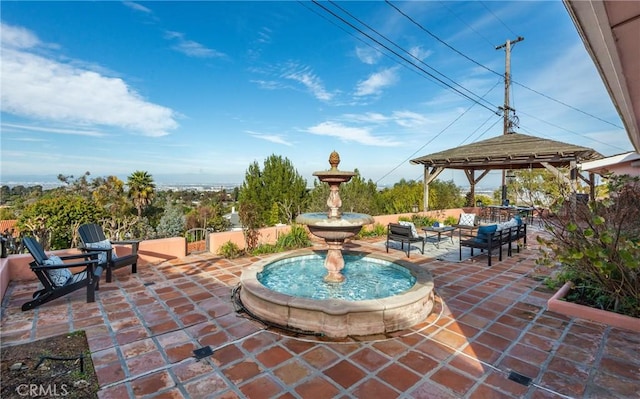 view of patio featuring a gazebo and an outdoor living space