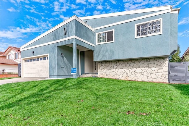 view of front of home with a garage and a front yard