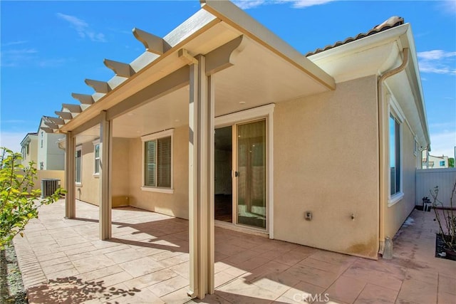 back of property with a patio and central AC unit